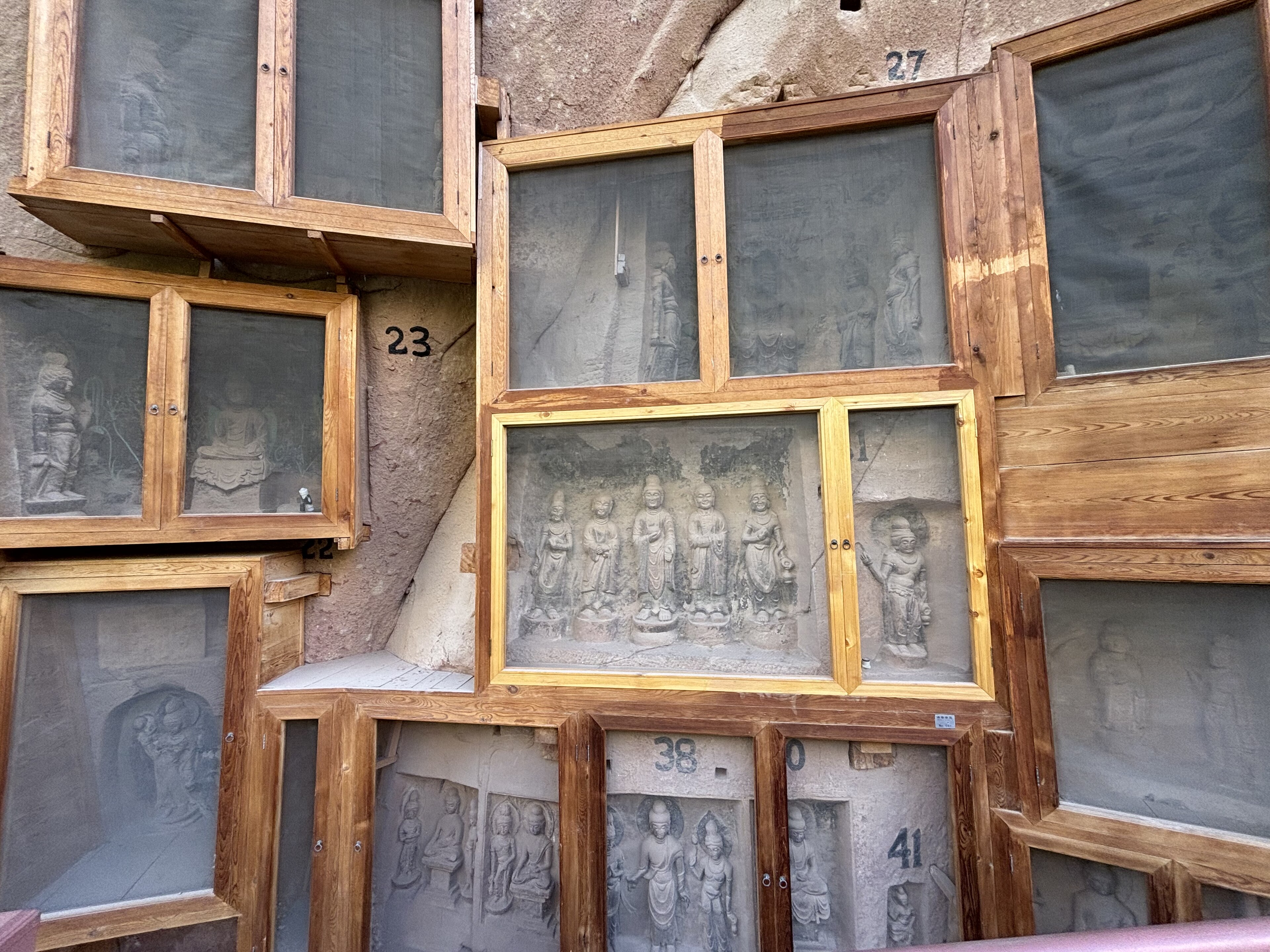 Carved niches on the red sandstone cliff at Bingling Temple, Linxia prefecture